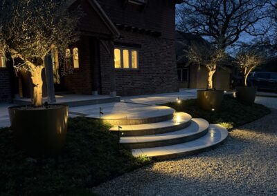 Garden lighting at dusk, Mayfield, by Abbey Garden Design, Sussex