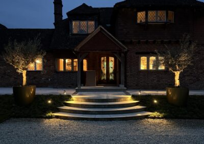 Garden lighting at dusk, Mayfield, by Abbey Garden Design, Sussex