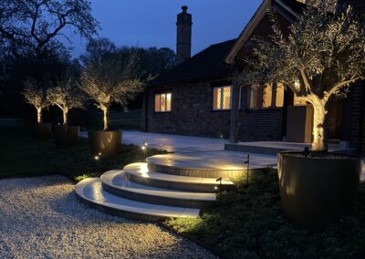 Garden lighting at dusk, Mayfield, by Abbey Garden Design, Sussex