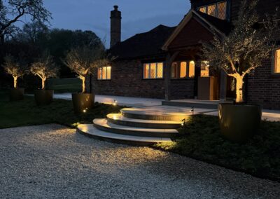 Garden lighting at dusk, Mayfield, by Abbey Garden Design, Sussex
